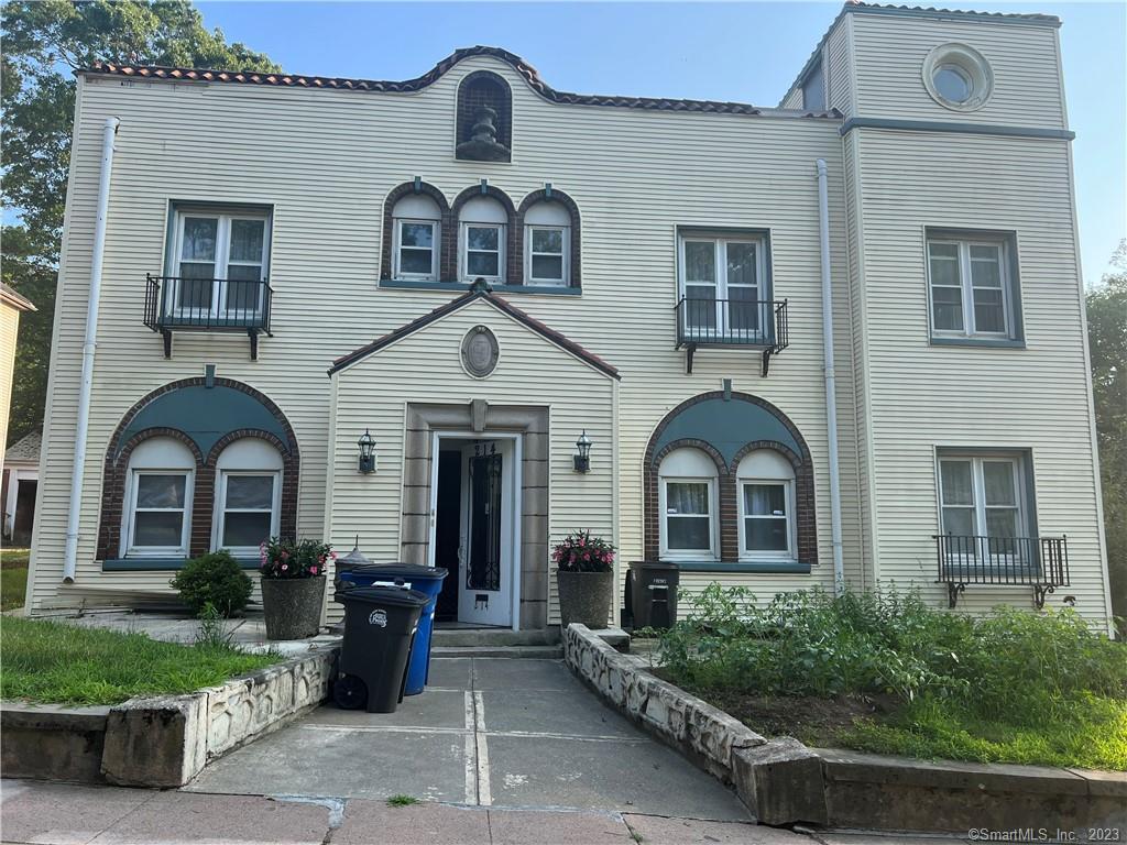 214 Goffe Terrace New Haven, CT 06511 - Photo 1 of 1 a front view of a house with a garden