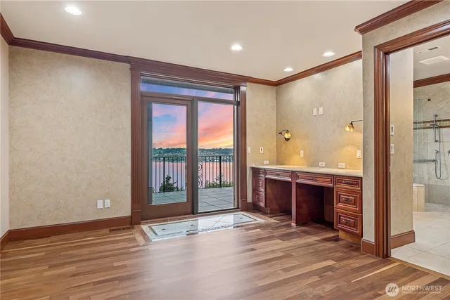 a view of work space with wooden floor and a window