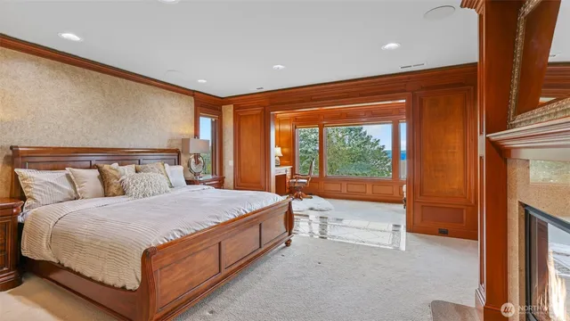 a bedroom with a large bed and a large window