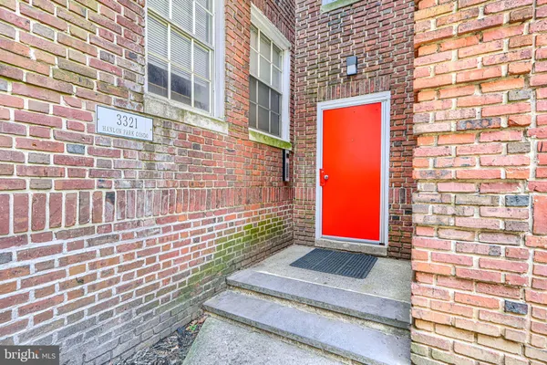 a view of a brick building with many windows