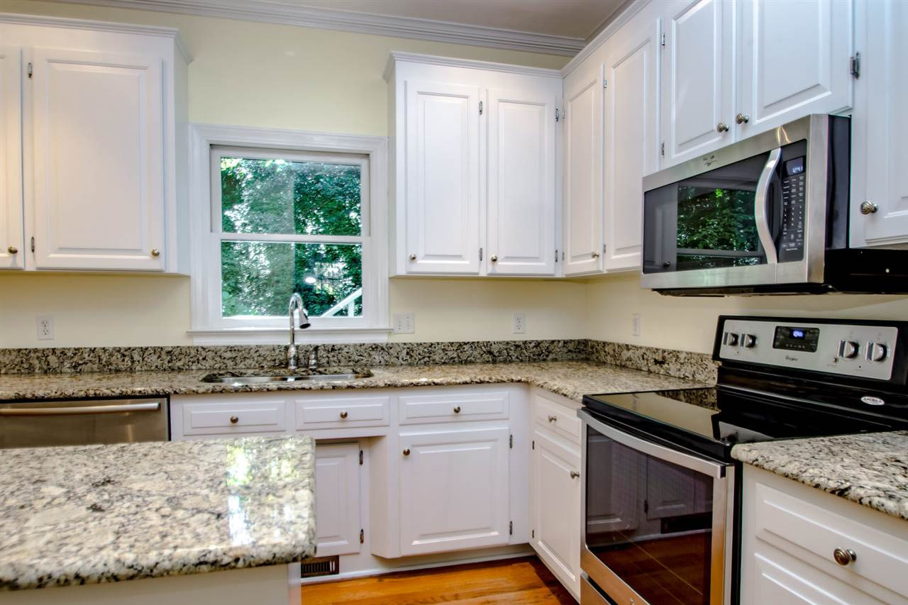 4609 Gramercy Court Raleigh, NC 27609 - Photo 11 of 22 Light pours through the windows and the kitchen overlooks the private back yard. Kitchen