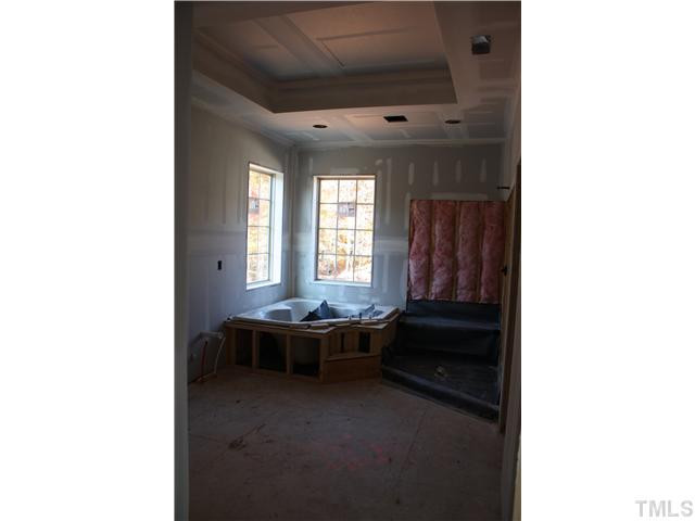 9211 Concord Hill Court Raleigh, NC 27613 - Photo 10 of 18 Large corner garden tub will feature tile tubdeck and surround. Huge walk-in shower with semi-frameless enclosure, granite vanity top and tile floors. Trey ceiling, separate water closet. Master Bath/Spa