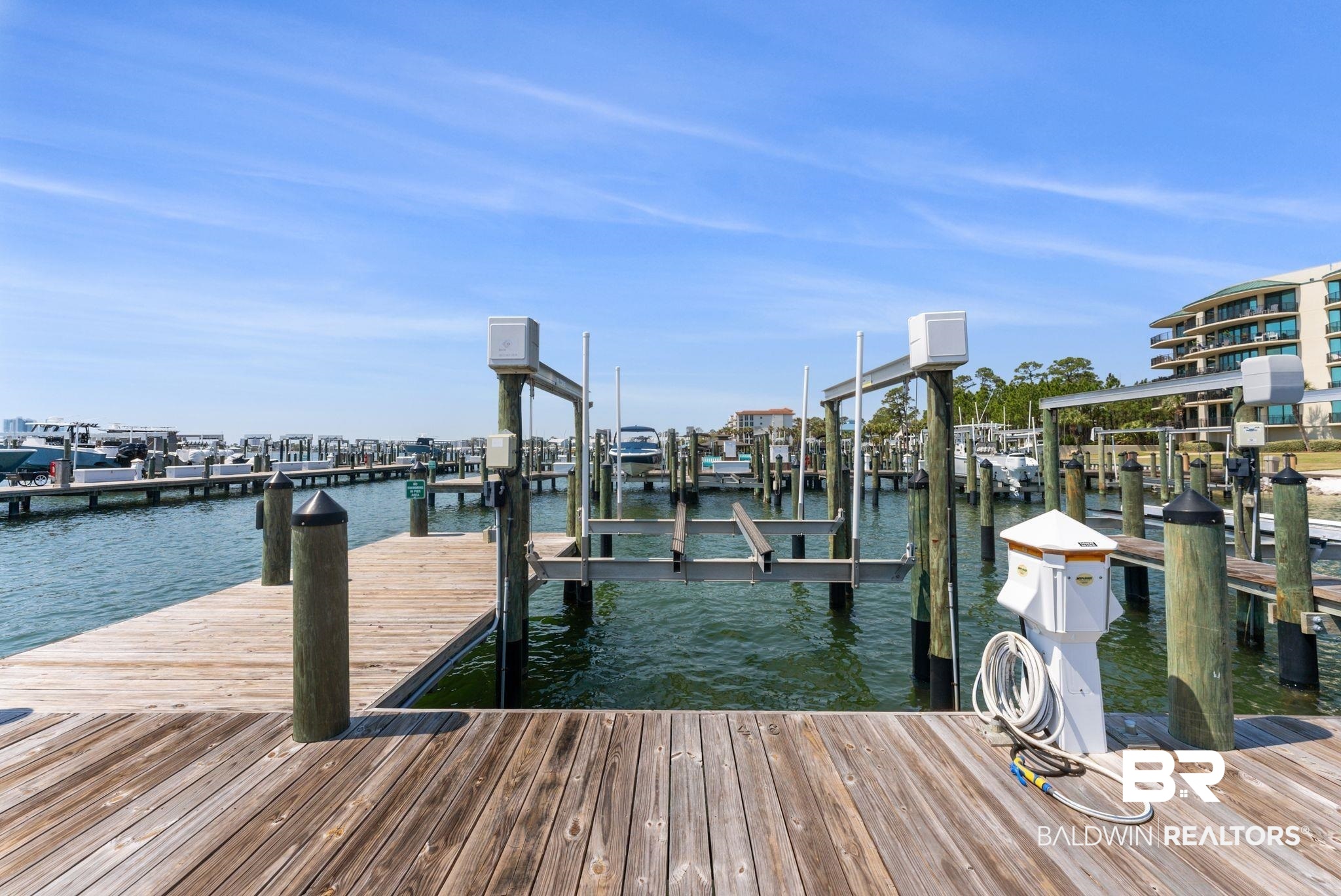 27580 Canal Road, Unit 1233 Orange Beach, AL 36561 - Photo 57 of 79 Dock with boat lift and a water view