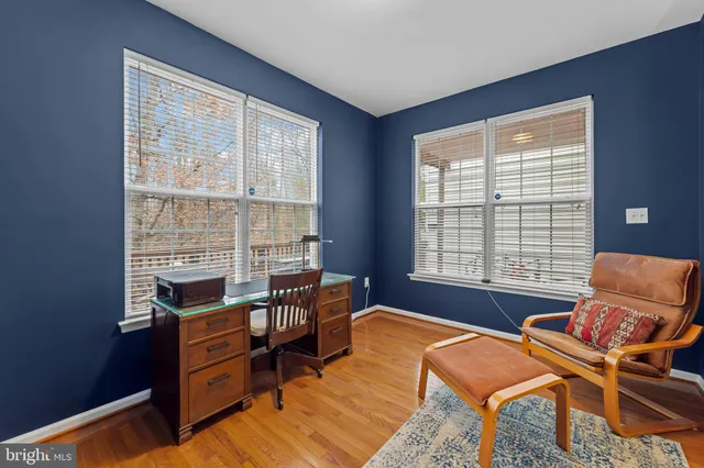 a reading room with furniture and a window