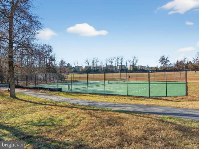 a view of a house with a porch and sitting area
