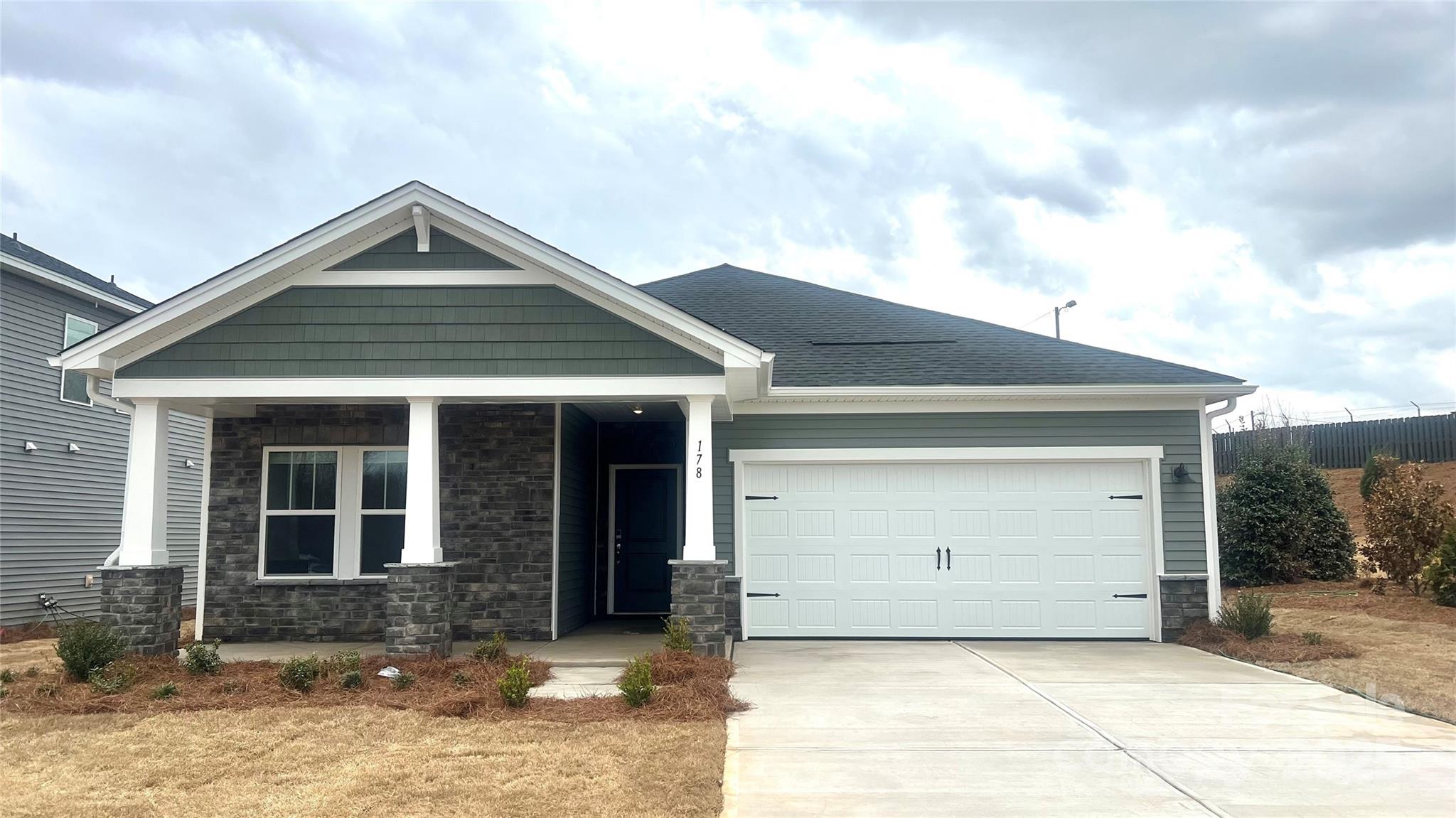 a front view of a house with a garage