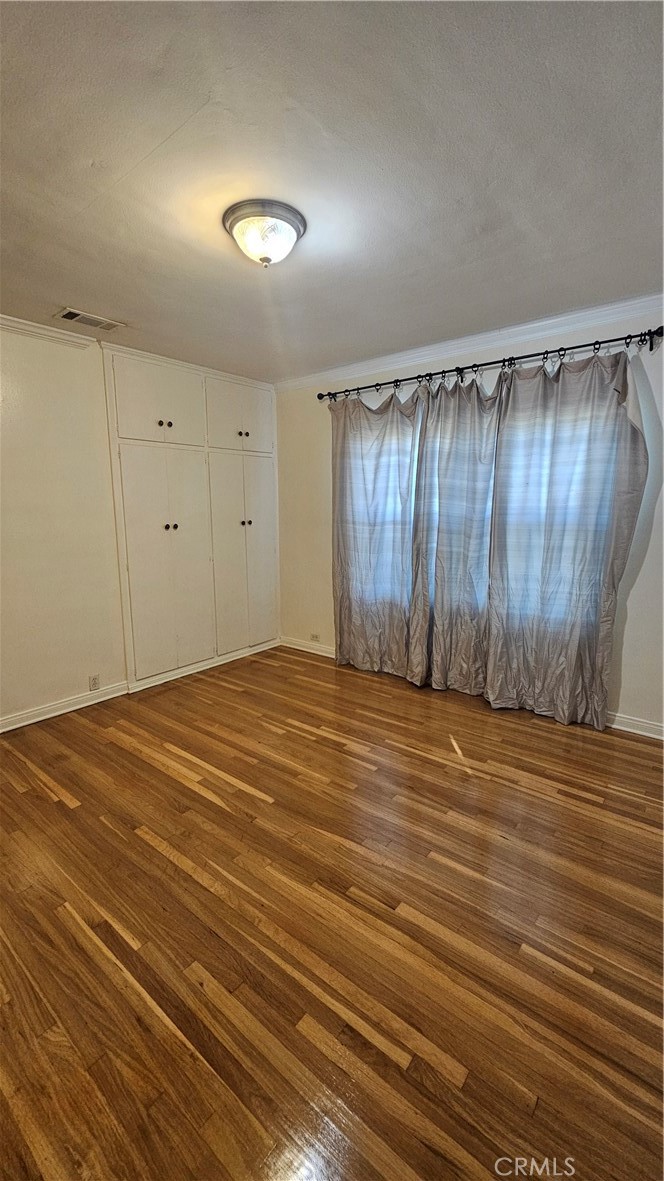 1525 Bellwood Road San Marino, CA 91108 - Photo 14 of 25 a view of a room with wooden floor and white walls