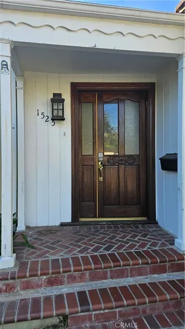 a view of a door with a potted plant