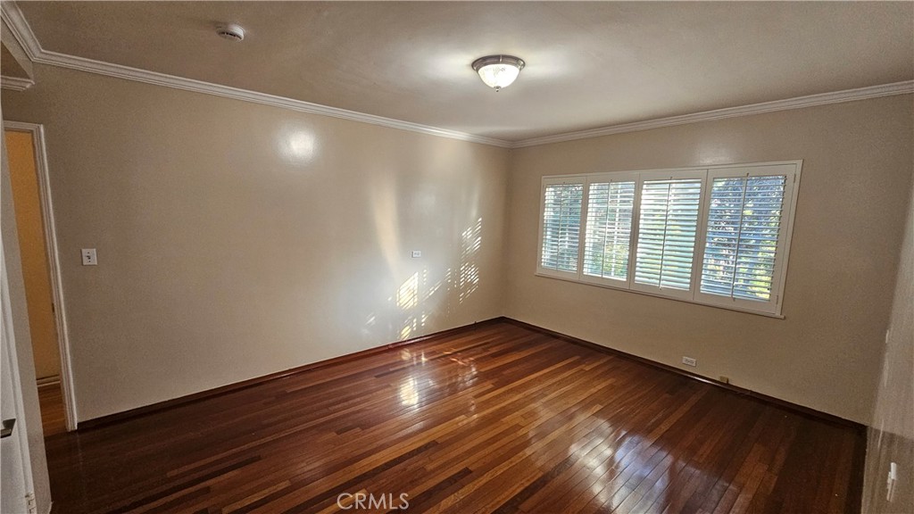 1525 Bellwood Road San Marino, CA 91108 - Photo 21 of 25 a view of an empty room with wooden floor and a window