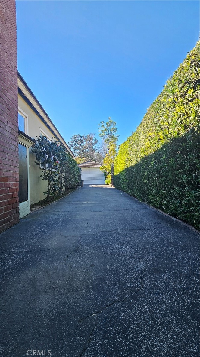 1525 Bellwood Road San Marino, CA 91108 - Photo 8 of 25 a view of a road with a yard