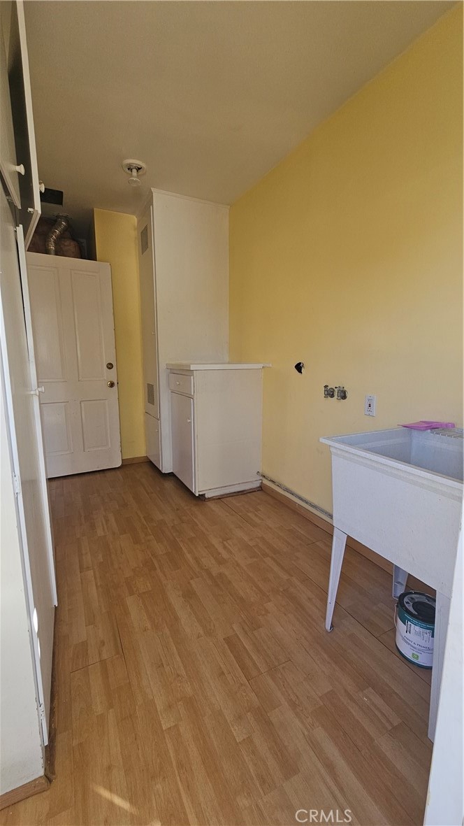 1525 Bellwood Road San Marino, CA 91108 - Photo 9 of 25 a view of a room with wooden floor and cabinet