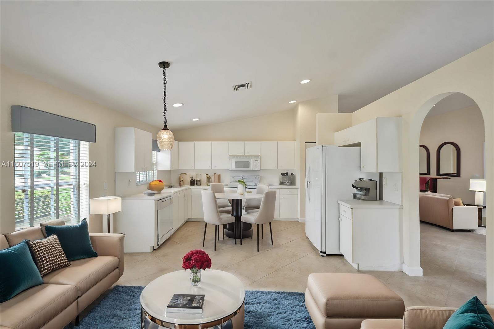 22740 Royal Crown Terrace East Boca Raton, FL 33433 - Photo 12 of 26 a living room with furniture kitchen view and a window