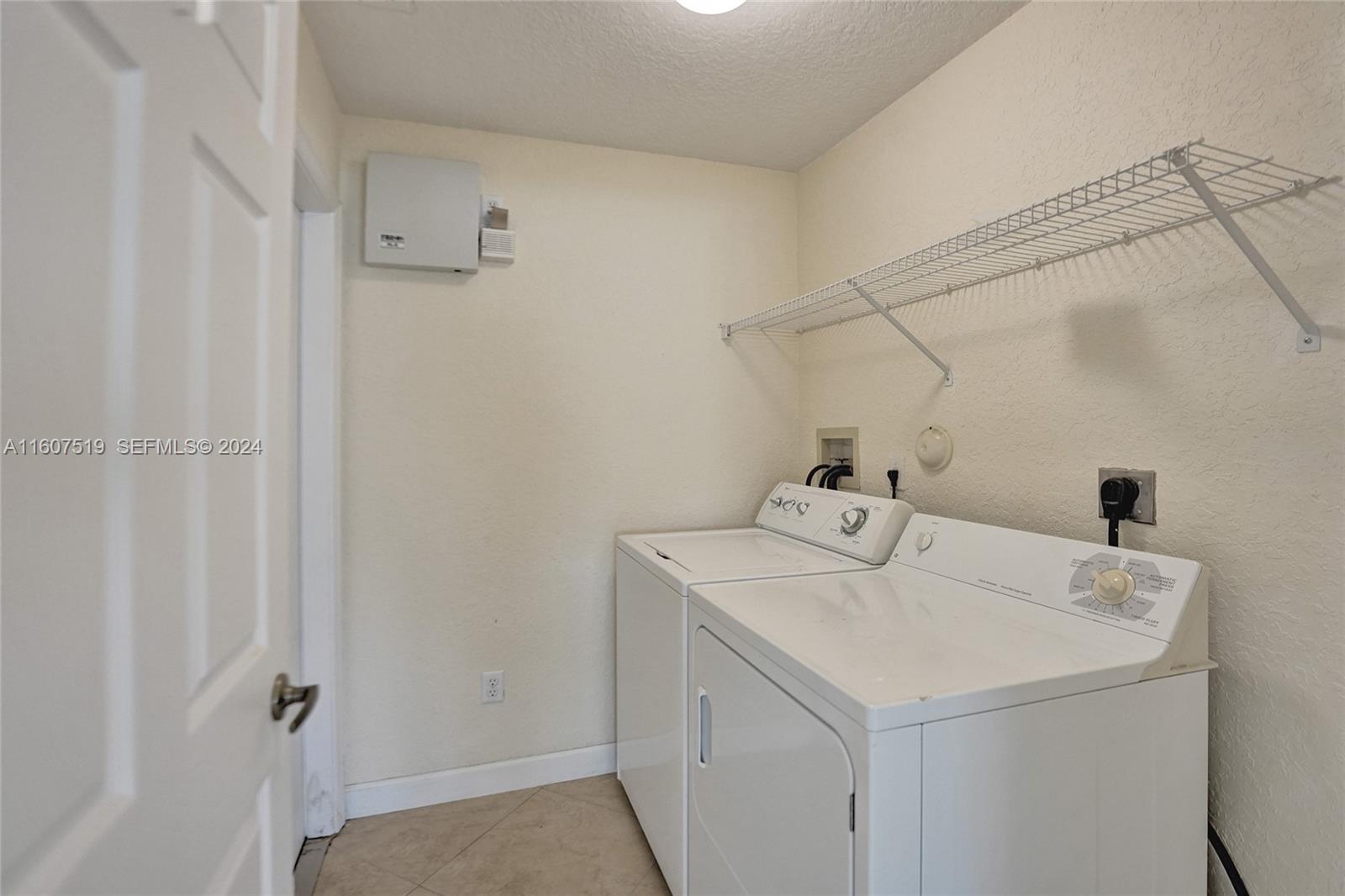 22740 Royal Crown Terrace East Boca Raton, FL 33433 - Photo 17 of 26 a utility room with dryer and washer
