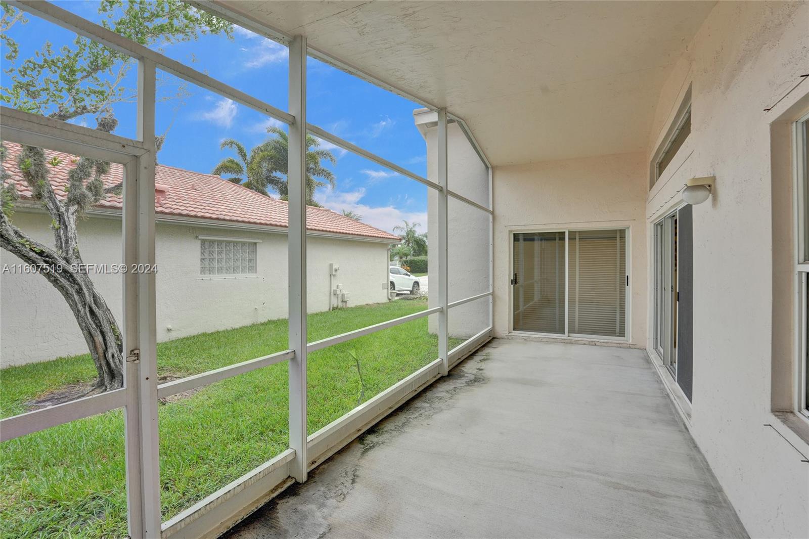 22740 Royal Crown Terrace East Boca Raton, FL 33433 - Photo 19 of 26 a view of a house with a large window