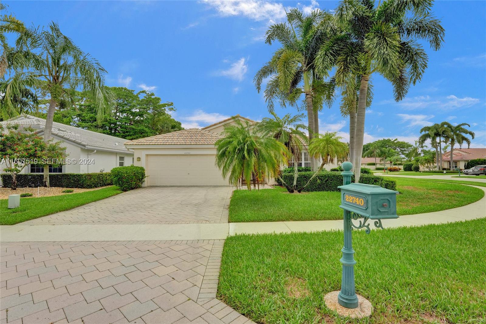 22740 Royal Crown Terrace East Boca Raton, FL 33433 - Photo 21 of 26 a view of a garden with a tree