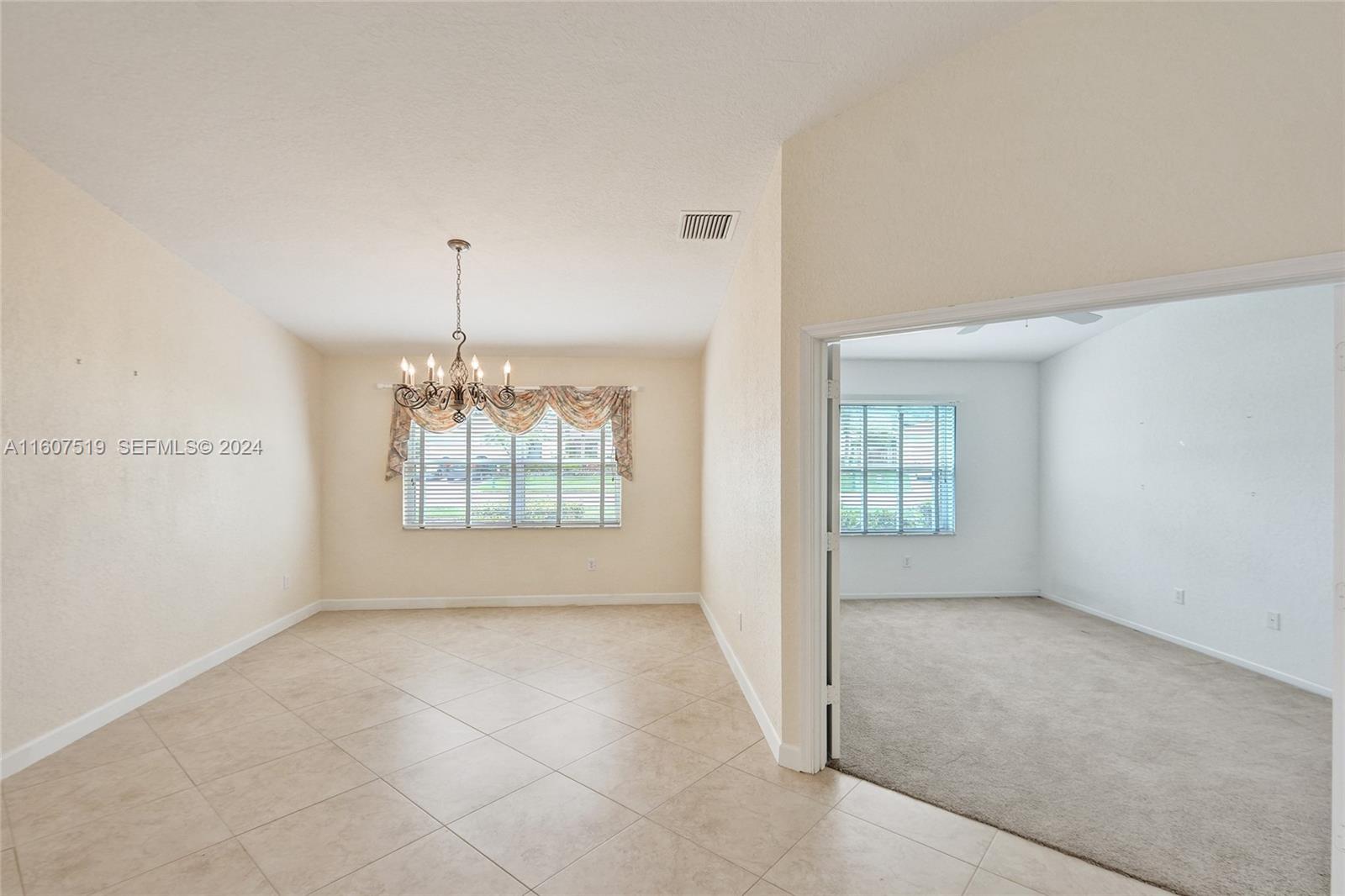 22740 Royal Crown Terrace East Boca Raton, FL 33433 - Photo 4 of 26 a view of an empty room with a window