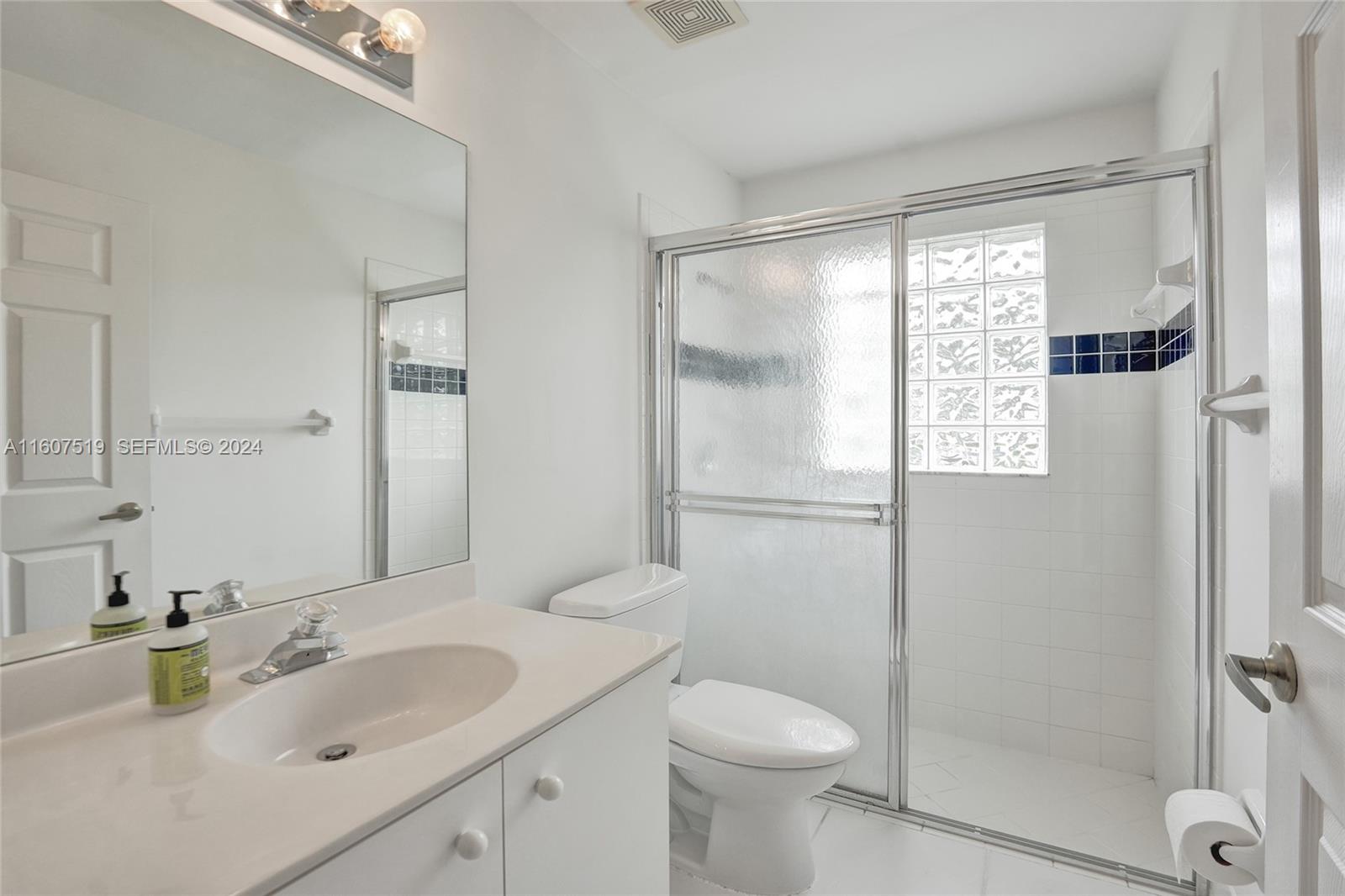 22740 Royal Crown Terrace East Boca Raton, FL 33433 - Photo 5 of 26 a bathroom with a sink toilet and shower