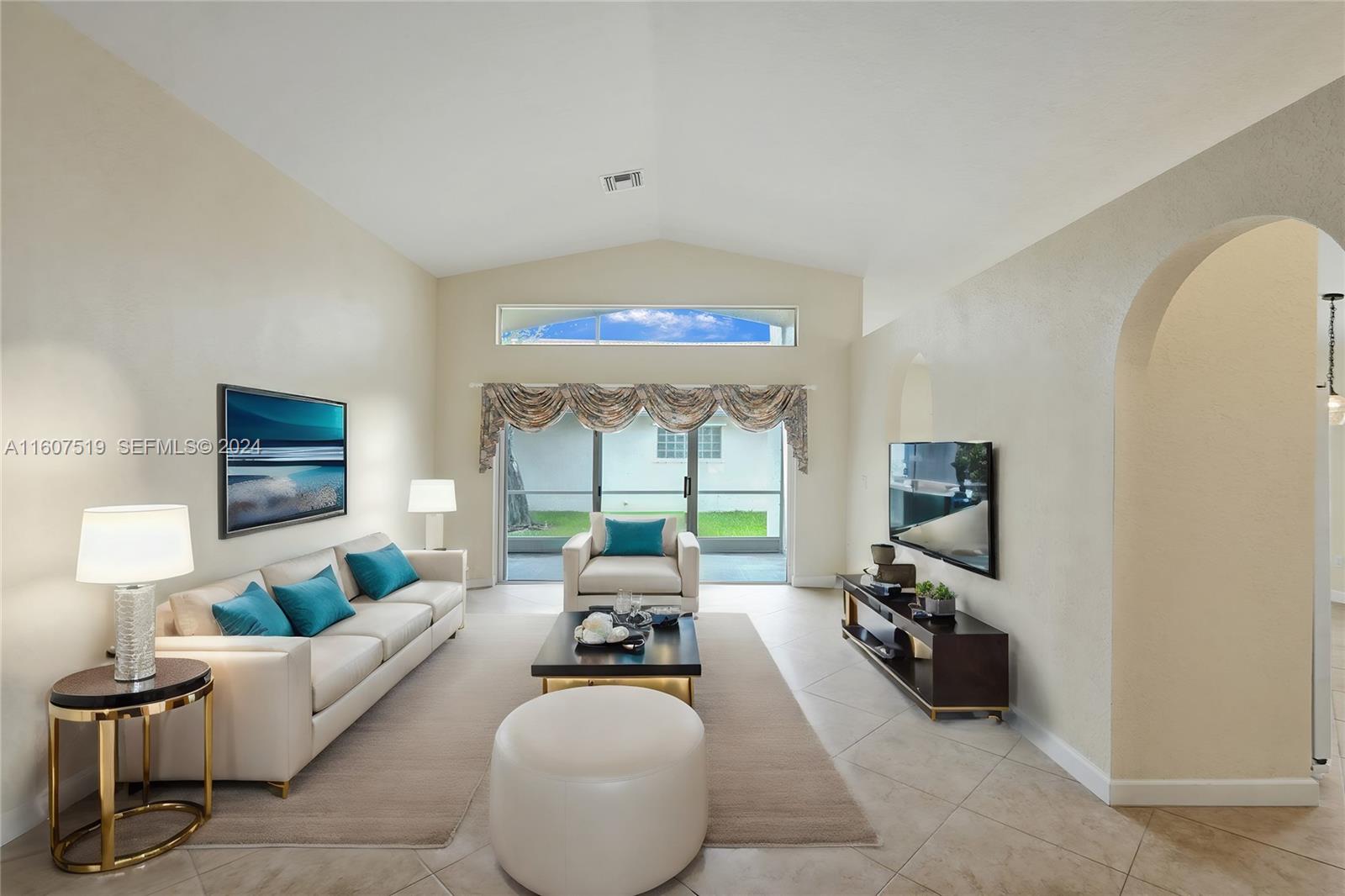 22740 Royal Crown Terrace East Boca Raton, FL 33433 - Photo 7 of 26 a living room with furniture and a large window