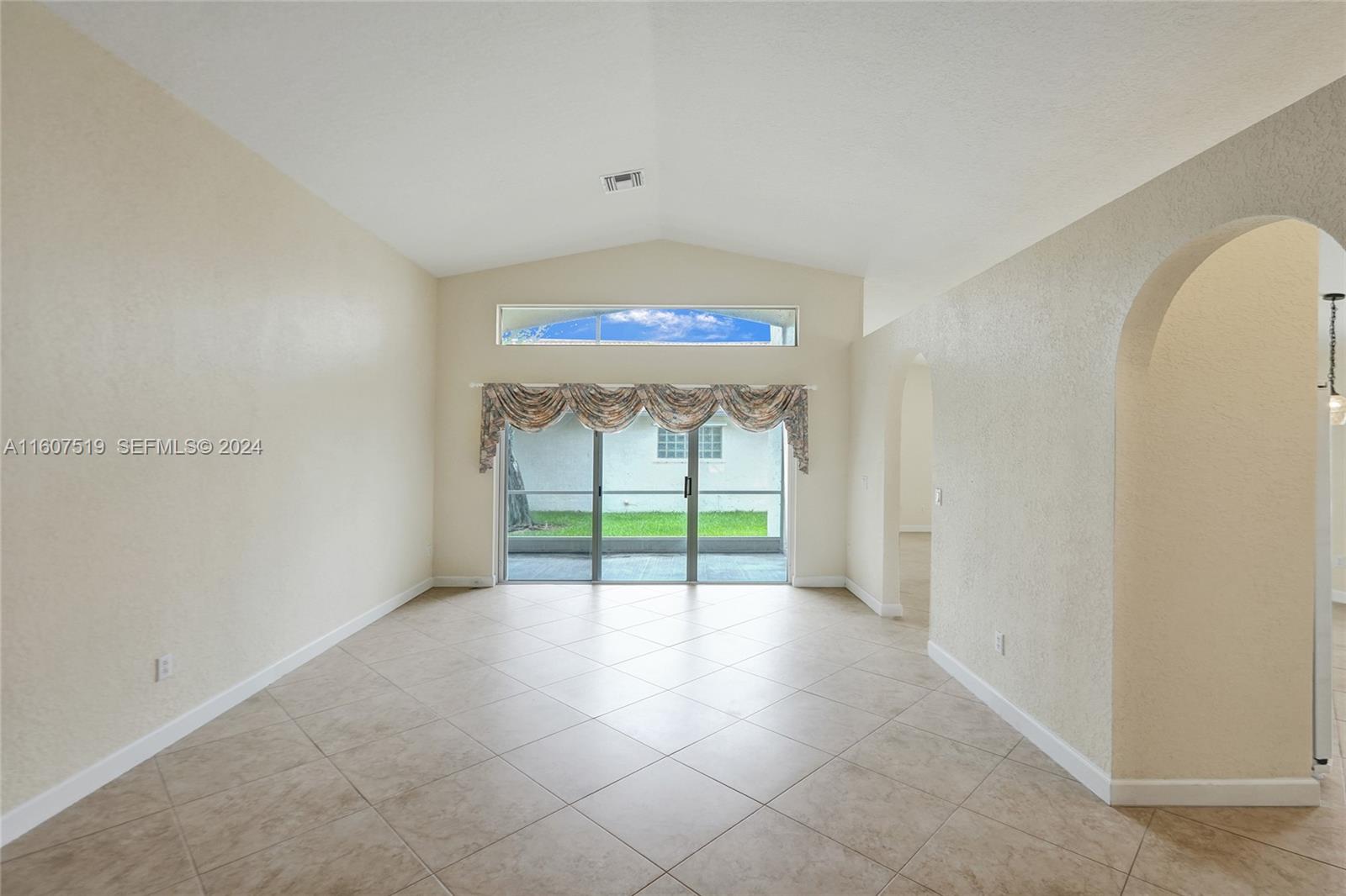 22740 Royal Crown Terrace East Boca Raton, FL 33433 - Photo 8 of 26 a view of an empty room with a window