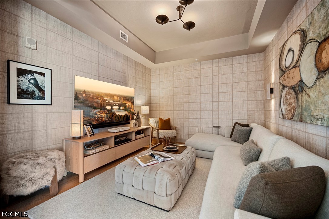 1115 Central Avenue, Unit 443 Naples, FL 34102 - Photo 18 of 40 a living room with furniture and a flat screen tv