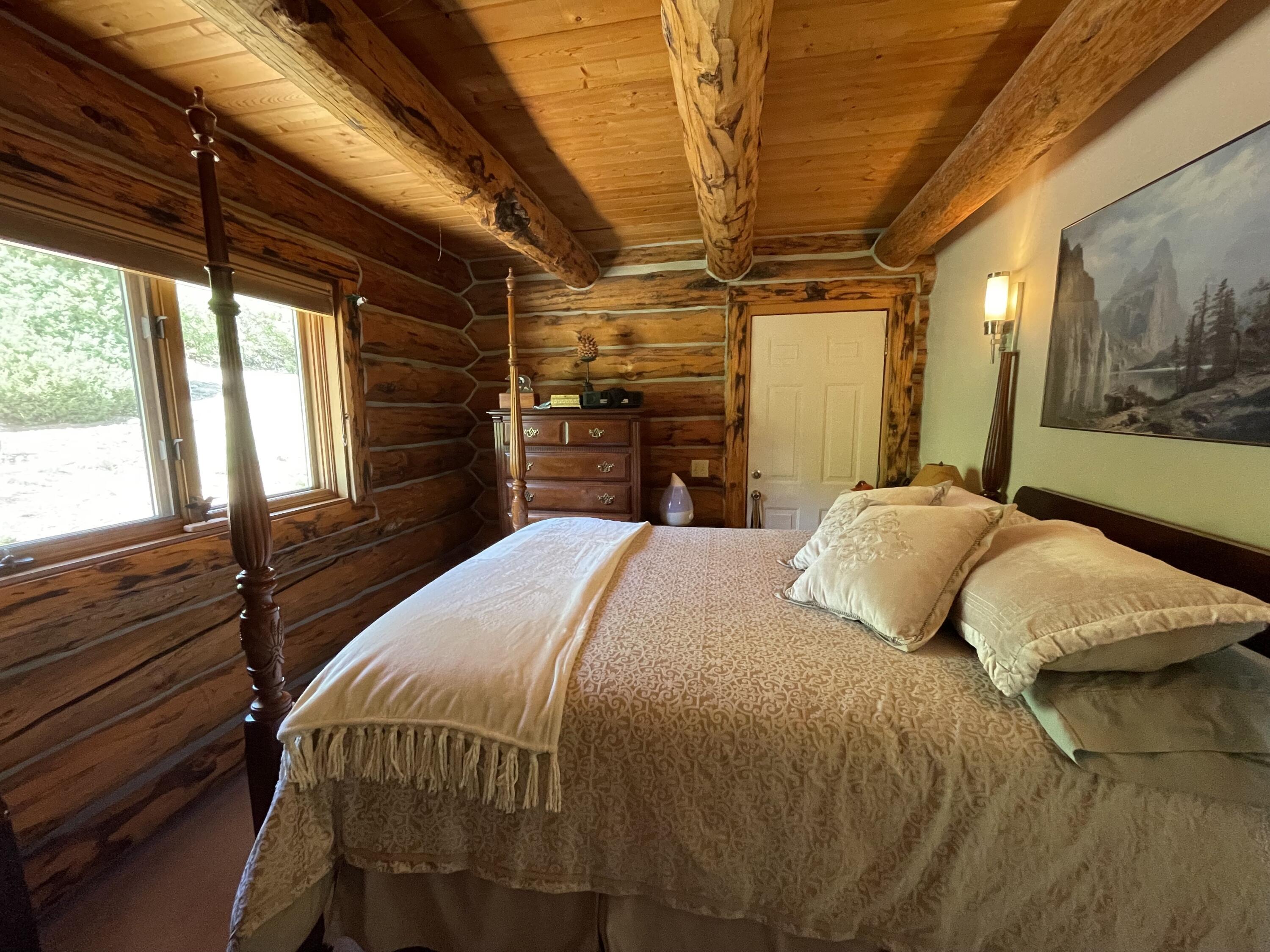2001 58P Road Placerville, CO 81430 - Photo 19 of 34 a bedroom with a bed next to a window