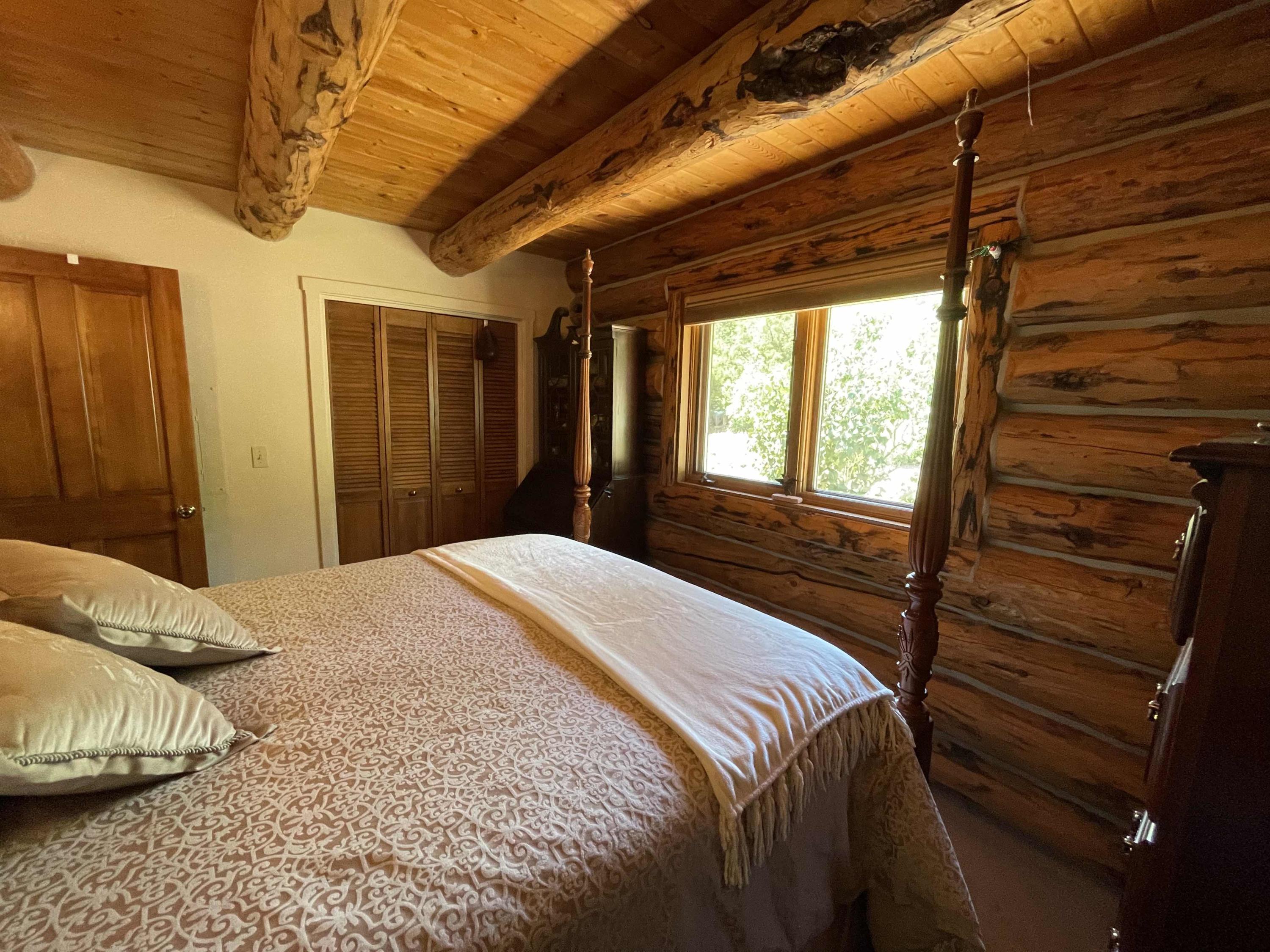 2001 58P Road Placerville, CO 81430 - Photo 20 of 34 a bedroom with a bed and a window