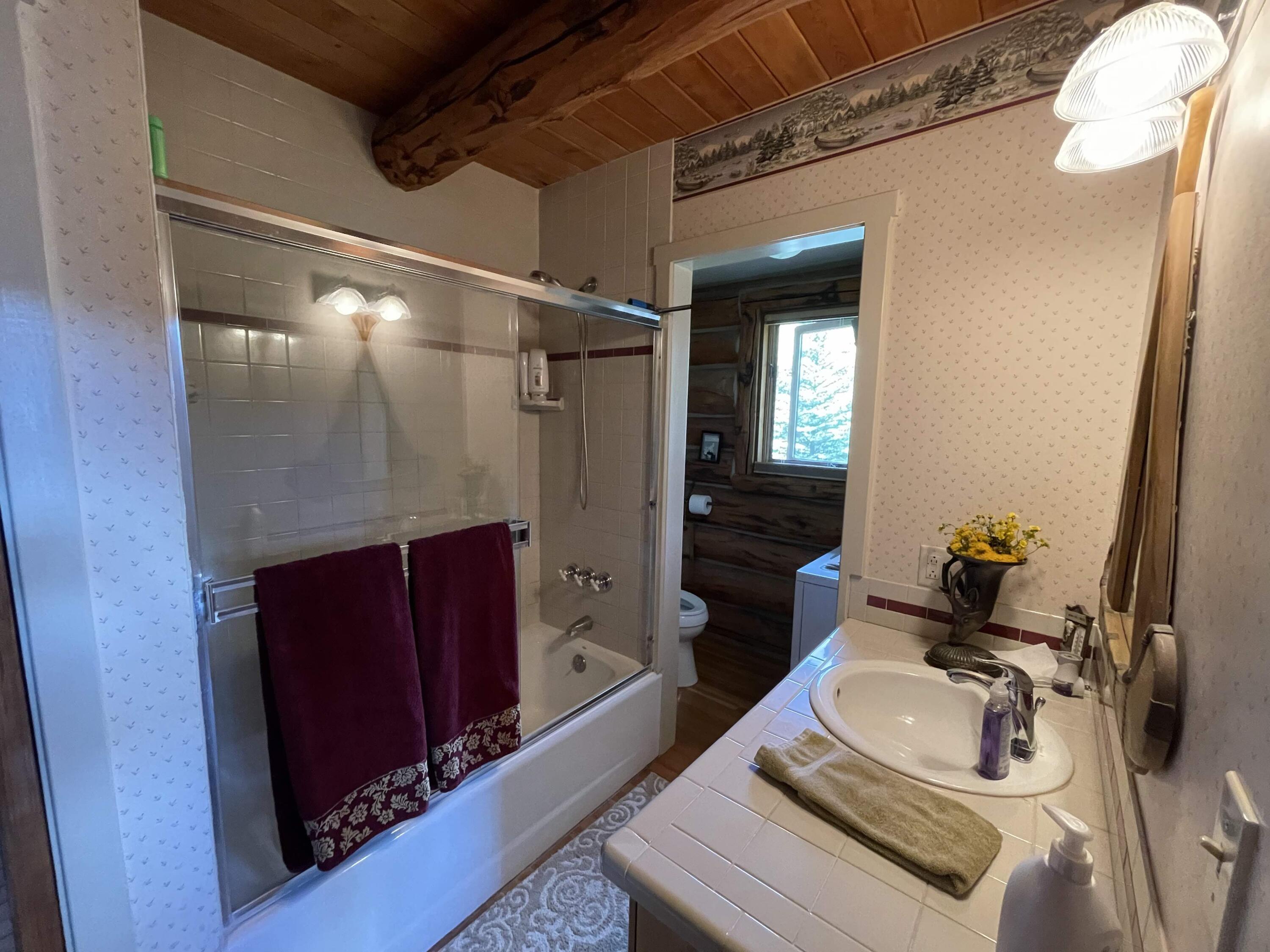 2001 58P Road Placerville, CO 81430 - Photo 23 of 34 a bathroom with a sink vanity granite tub and shower