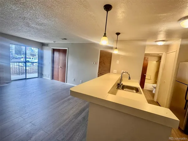 a kitchen with sink and window