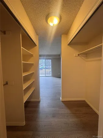 a bathroom with a double vanity sink toilet mirror and shower