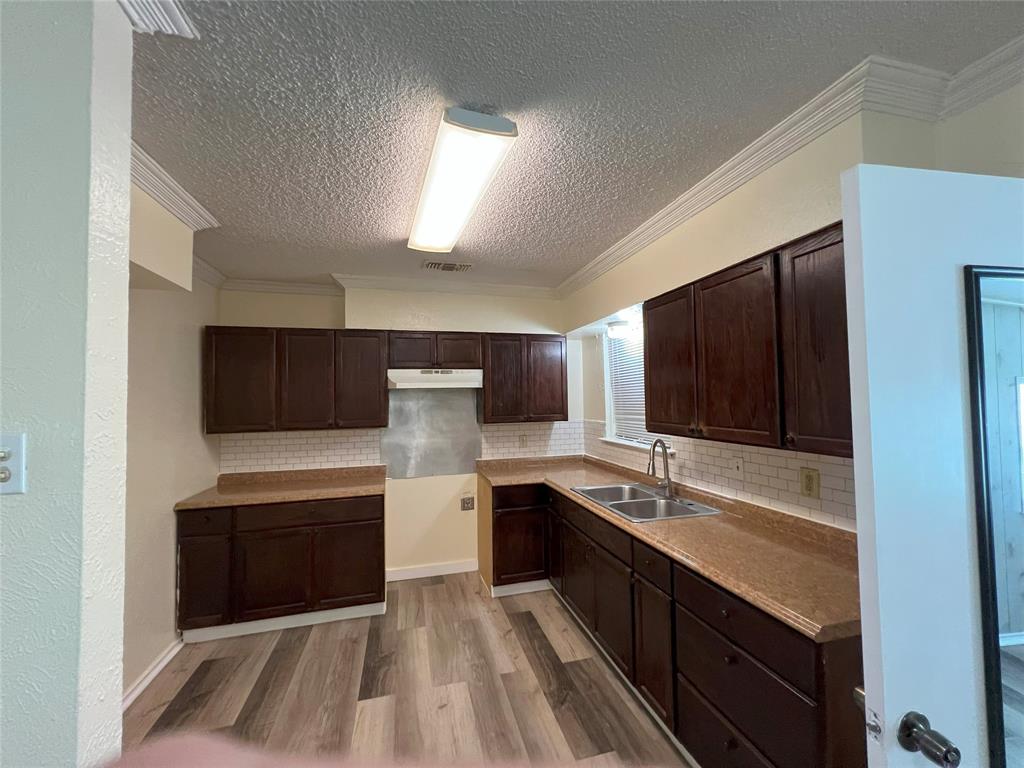 3601 Aloha Circle Mesquite, TX 75150 - Photo 14 of 22 a large kitchen with a sink and dishwasher stove top oven