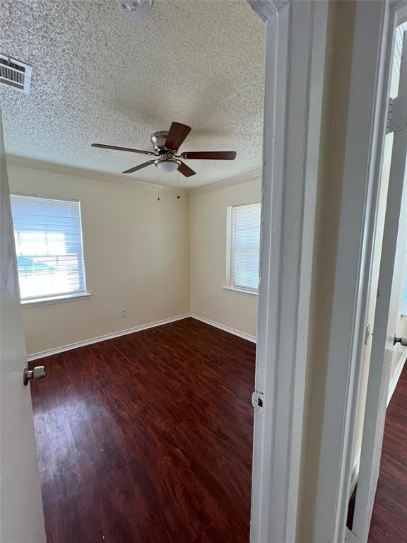 3601 Aloha Circle Mesquite, TX 75150 - Photo 18 of 22 a view of an empty room with a window and wooden floor