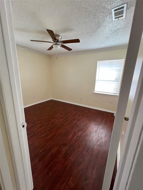 3601 Aloha Circle Mesquite, TX 75150 - Photo 19 of 22 an empty room with wooden floor fan and windows