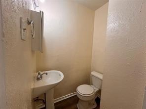 3601 Aloha Circle Mesquite, TX 75150 - Photo 22 of 22 a bathroom with a sink and a toilet