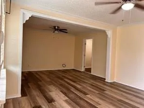 a view of a room with wooden floor and closet