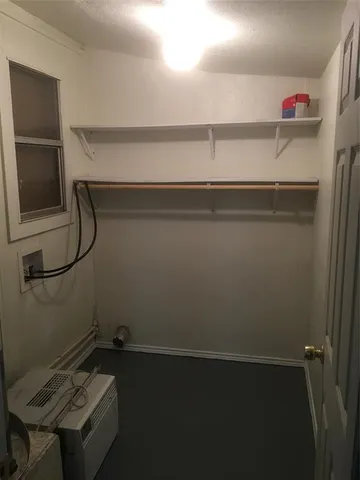 a room with a desk and a mirror