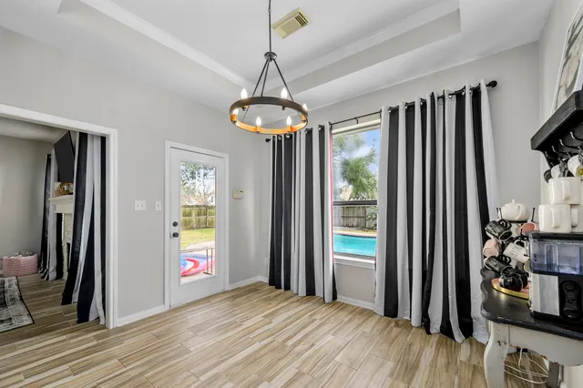 a view of livingroom with hardwood floor and hallway
