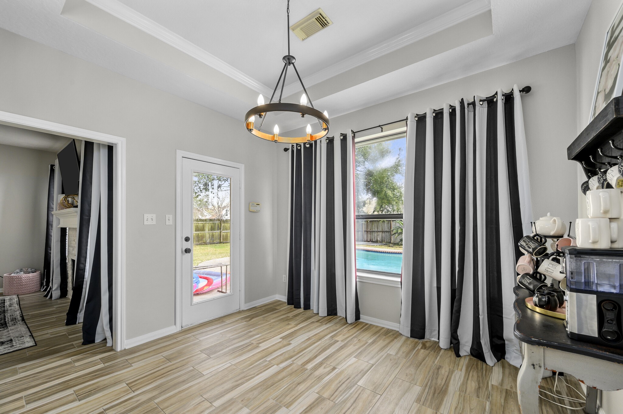 12302 Fisher Drive Mont Belvieu, TX 77523 - Photo 11 of 23 a view of livingroom with hardwood floor and hallway