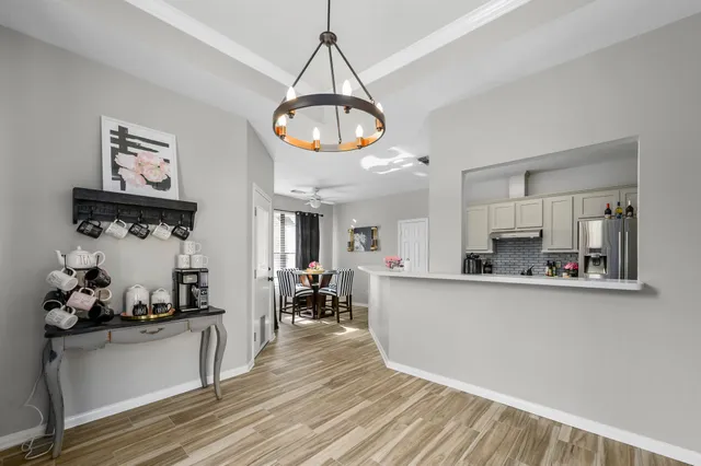 a kitchen with wooden floor