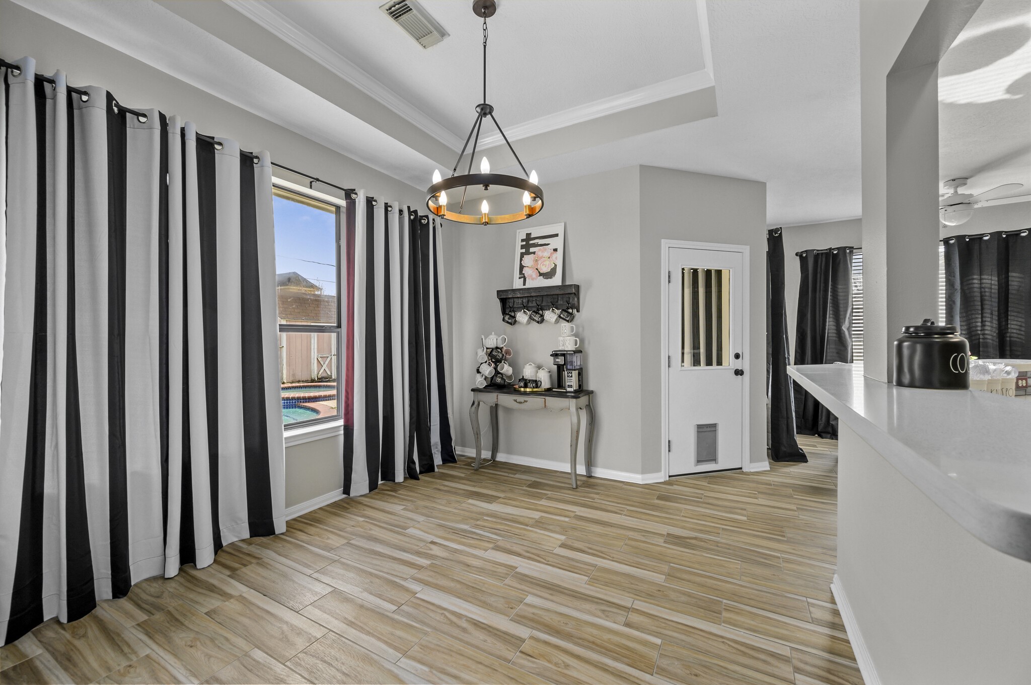 12302 Fisher Drive Mont Belvieu, TX 77523 - Photo 13 of 23 a view of a room with wooden floor and windows