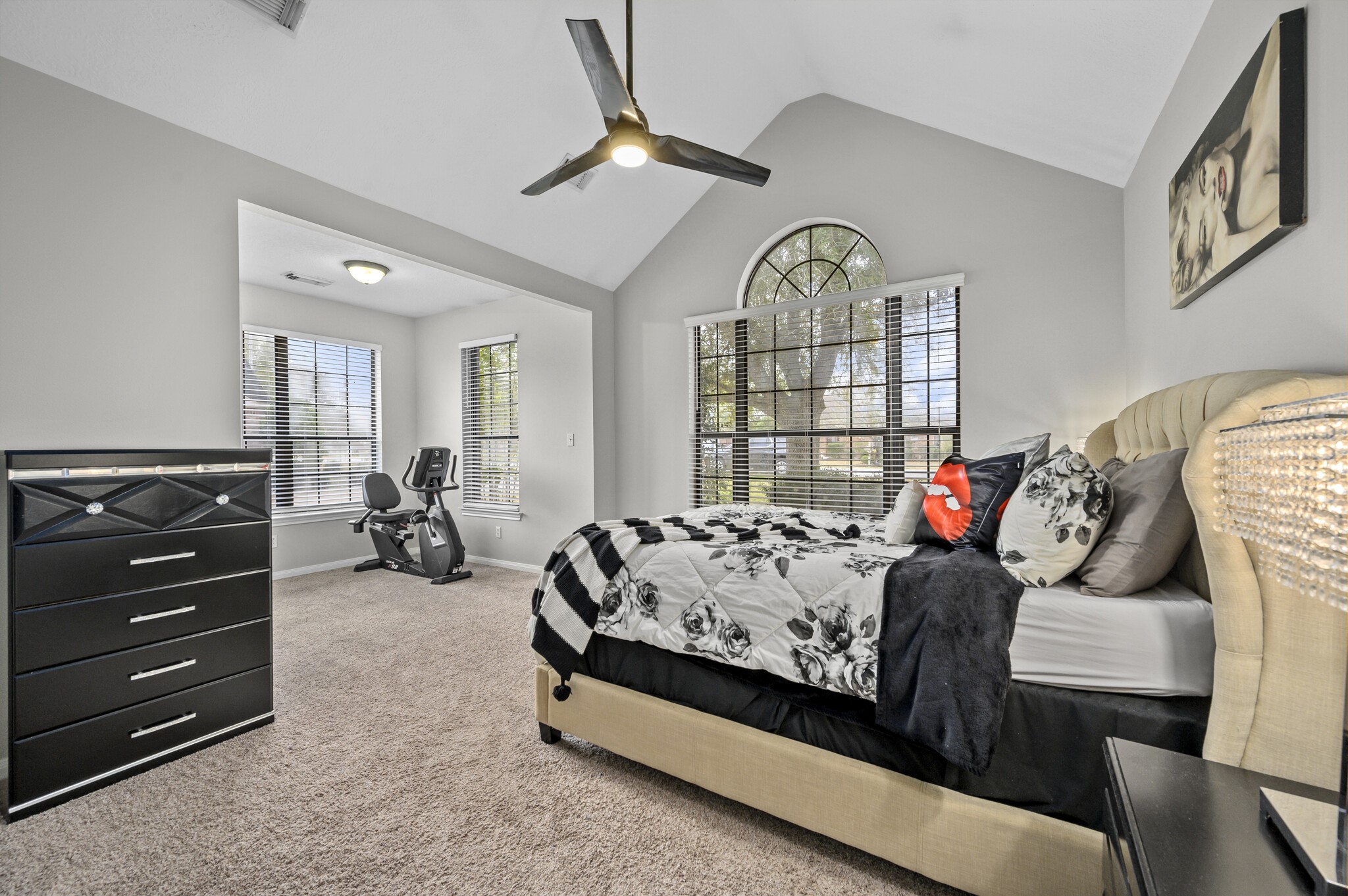 12302 Fisher Drive Mont Belvieu, TX 77523 - Photo 15 of 23 a bedroom with furniture and a large window