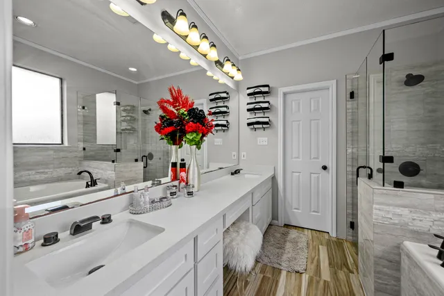 a bathroom with a sink double vanity and a mirror