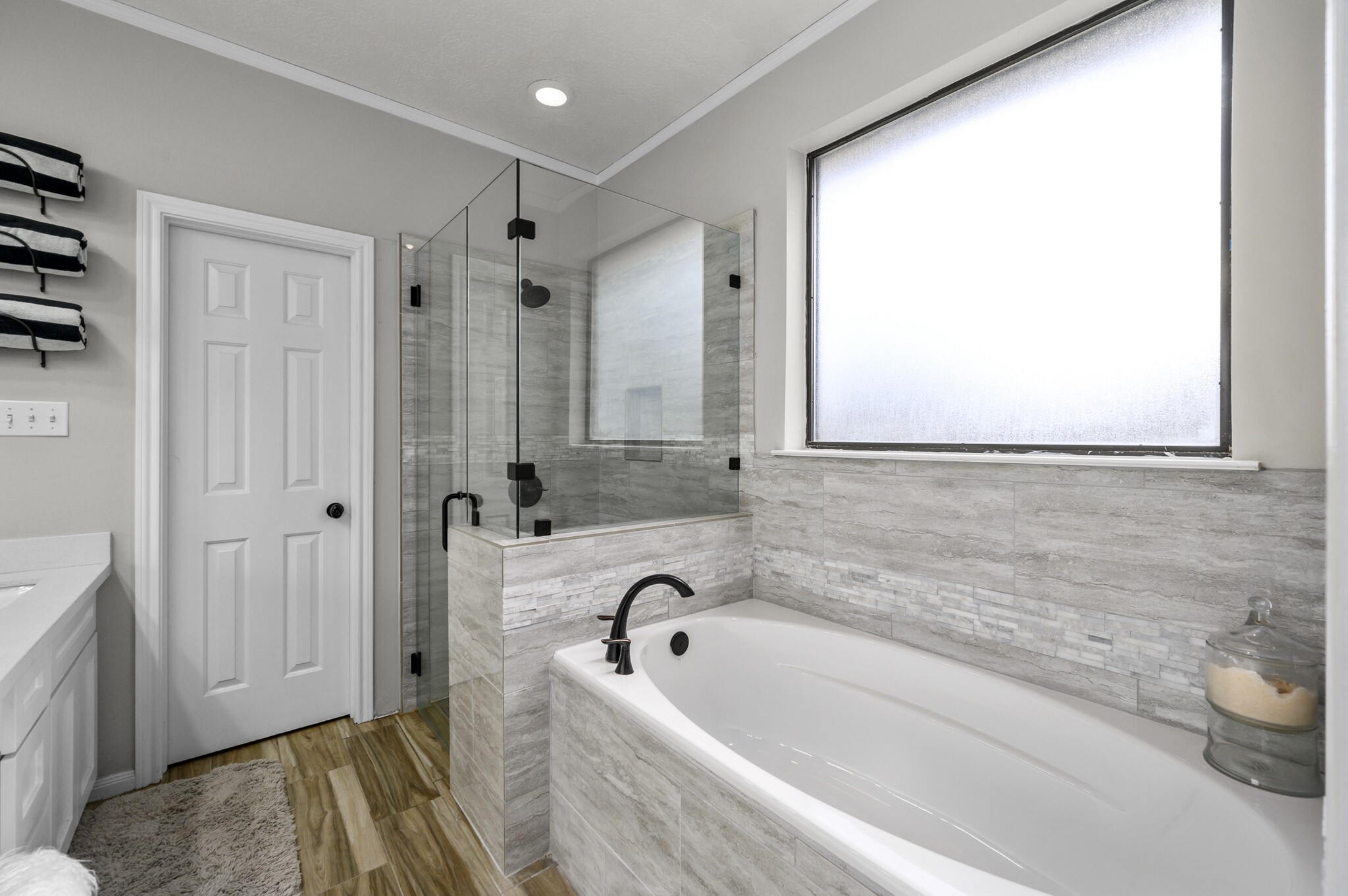 12302 Fisher Drive Mont Belvieu, TX 77523 - Photo 18 of 23 a bathroom with a tub and a sink