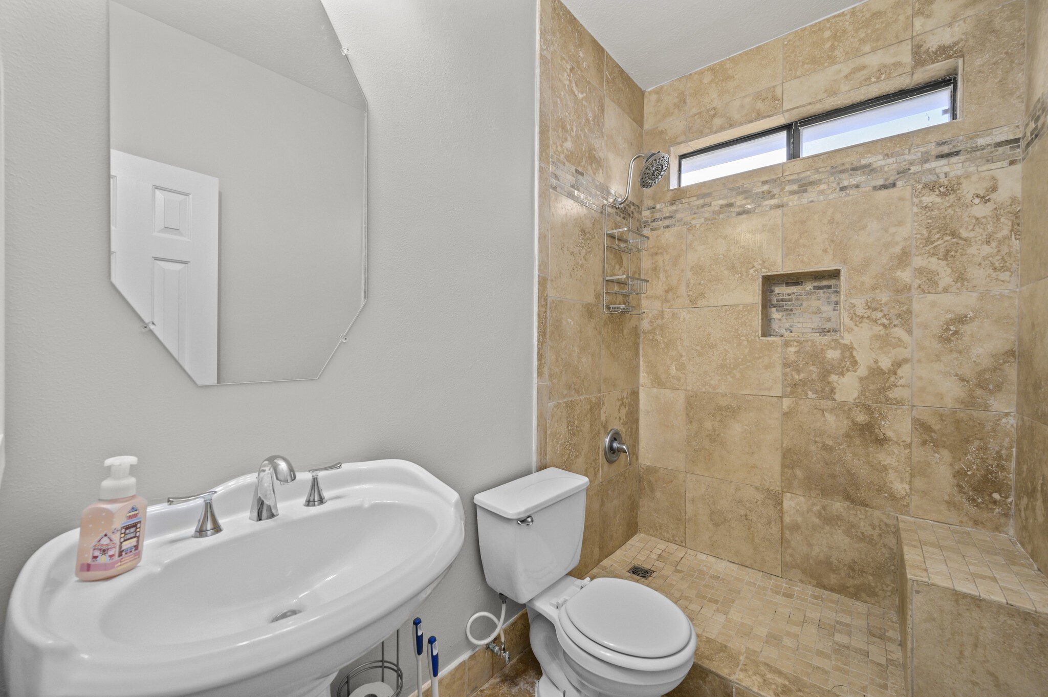 12302 Fisher Drive Mont Belvieu, TX 77523 - Photo 20 of 23 a bathroom with a sink toilet and shower