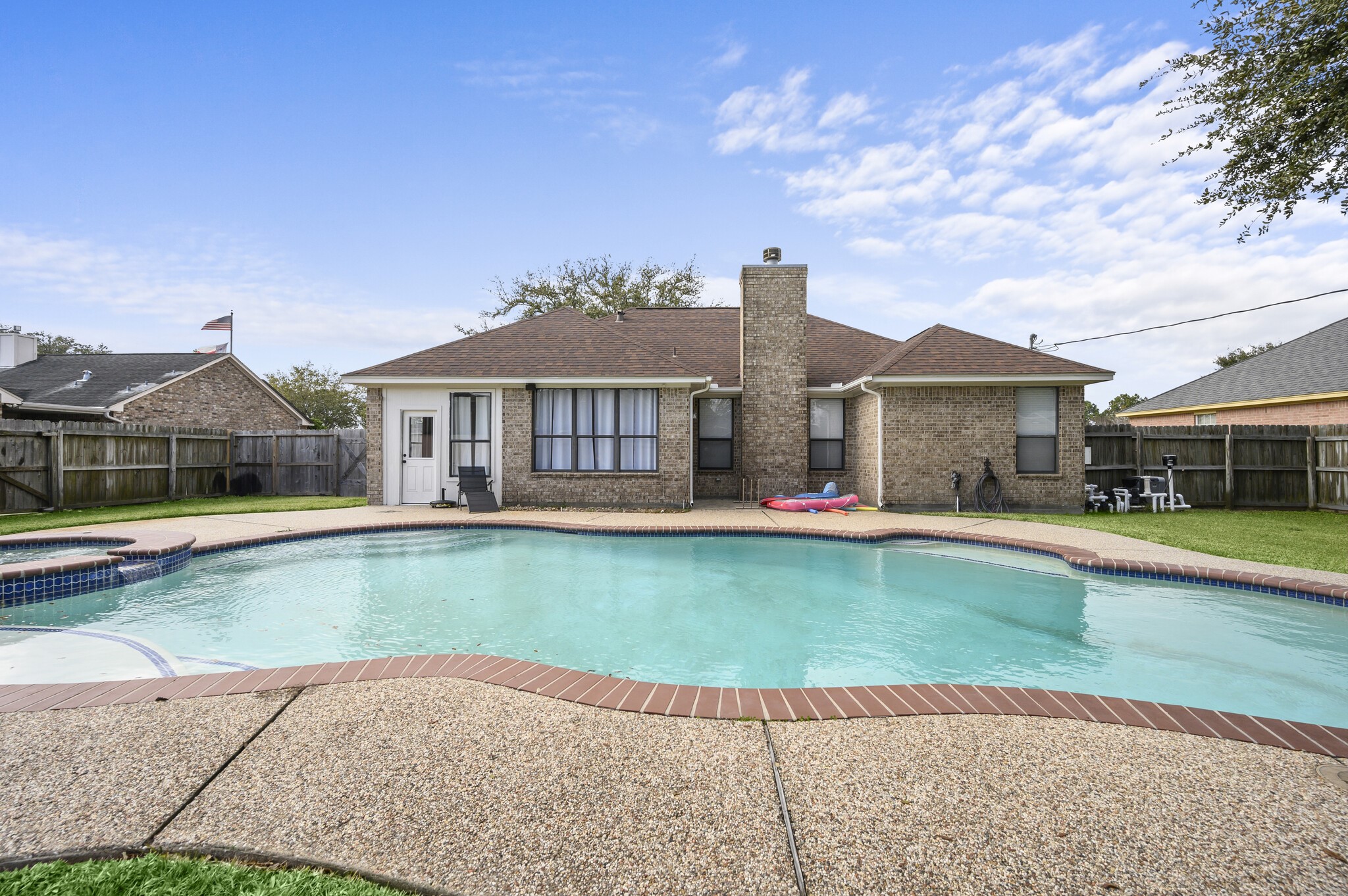 12302 Fisher Drive Mont Belvieu, TX 77523 - Photo 22 of 23 a front view of a house with a garden