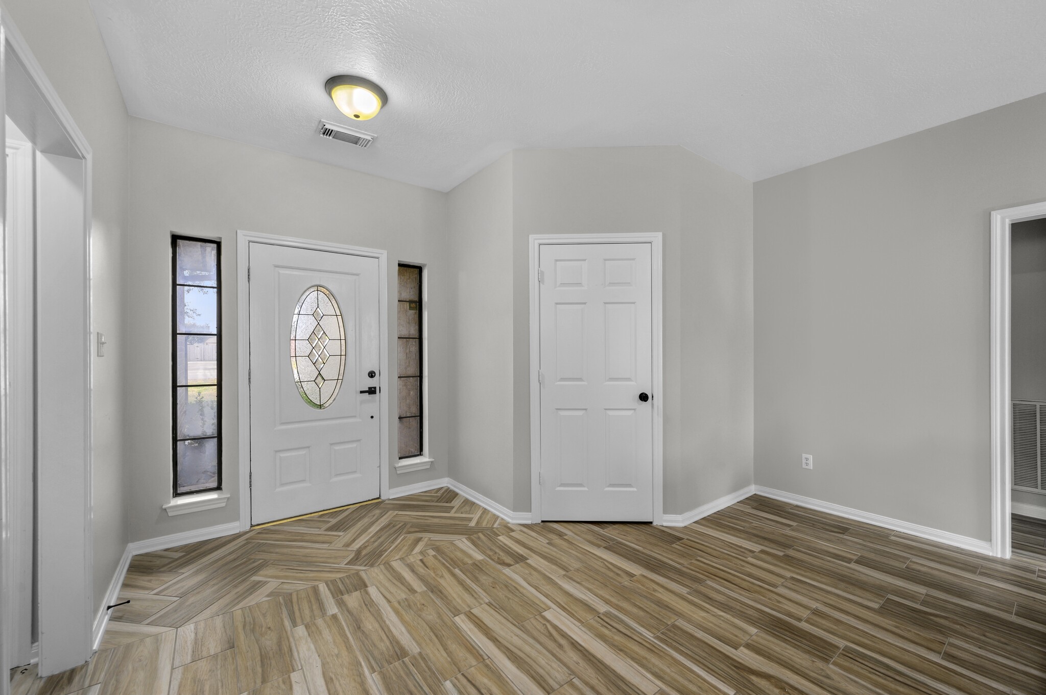 12302 Fisher Drive Mont Belvieu, TX 77523 - Photo 4 of 23 a bedroom with wooden floor and window