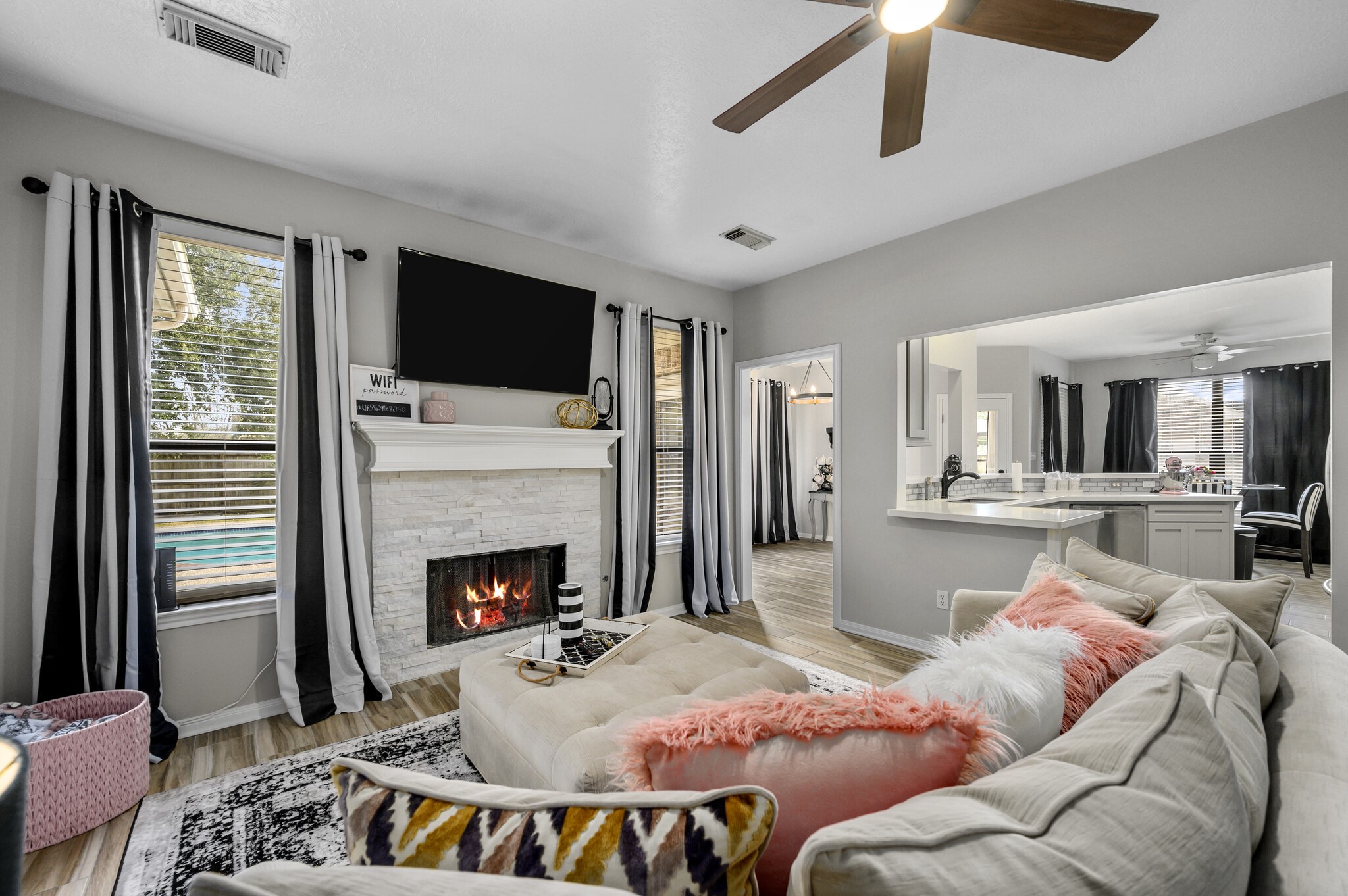 12302 Fisher Drive Mont Belvieu, TX 77523 - Photo 6 of 23 a living room with furniture fireplace and flat screen tv