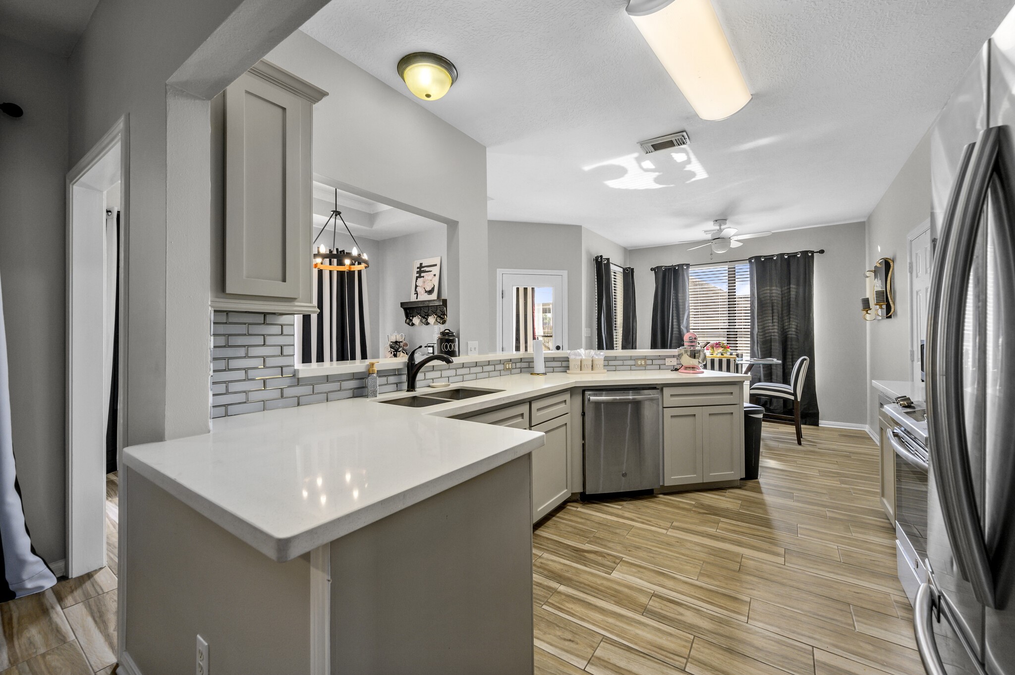 12302 Fisher Drive Mont Belvieu, TX 77523 - Photo 8 of 23 a large kitchen with a sink and refrigerator
