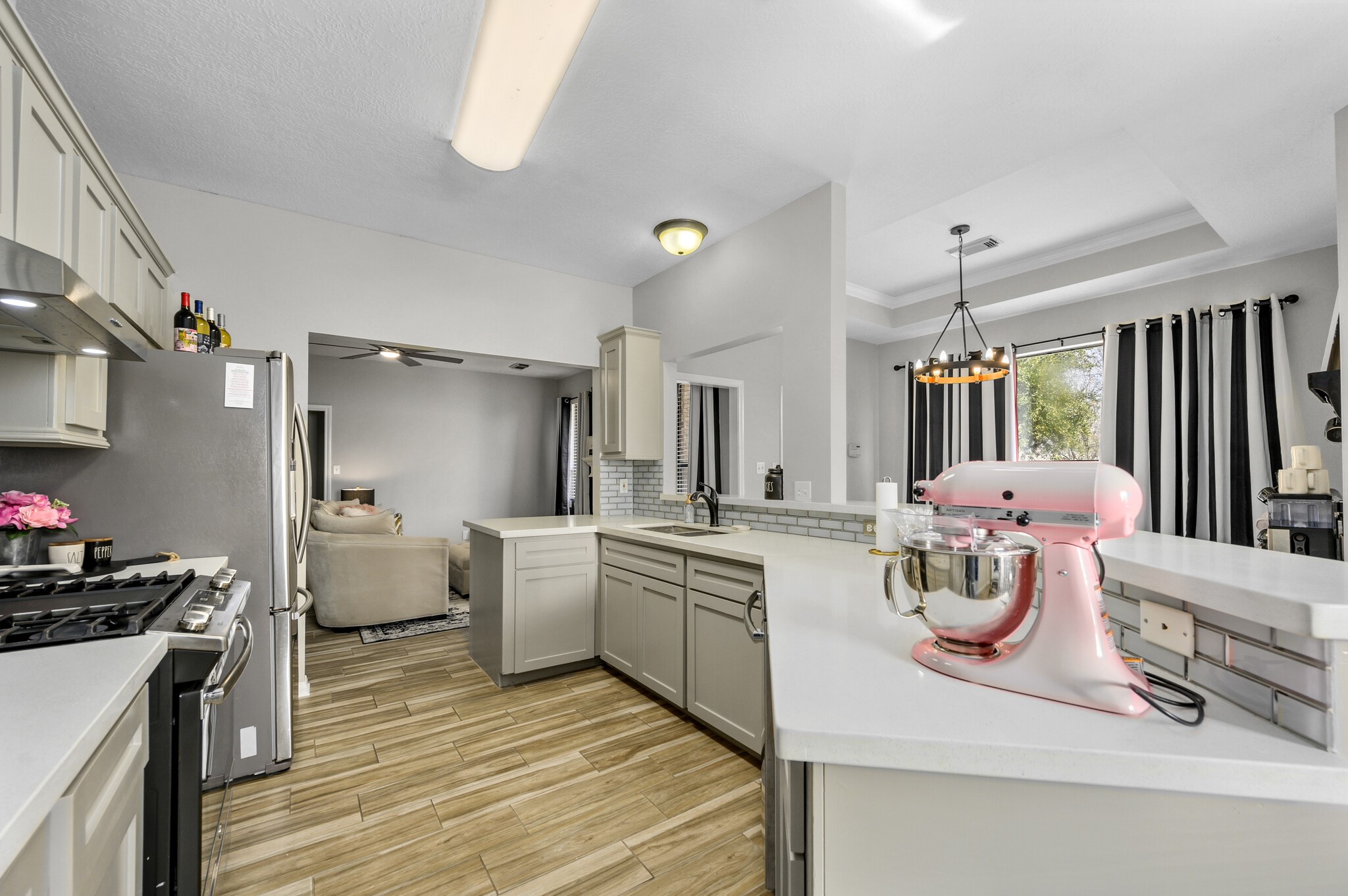 12302 Fisher Drive Mont Belvieu, TX 77523 - Photo 10 of 23 a kitchen with stove and refrigerator