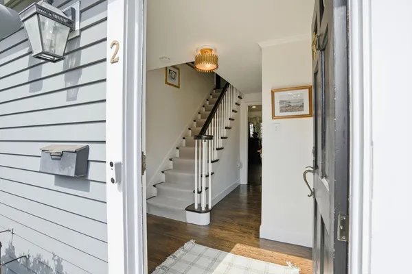 a view of staircase with white walls and stairs