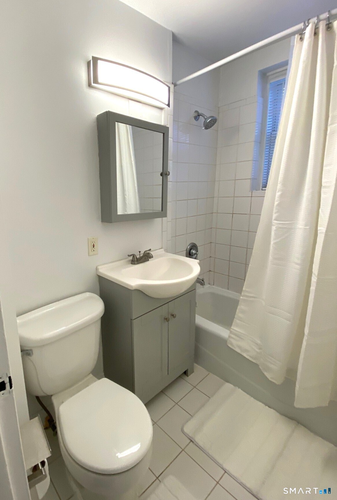 46 Prospect Avenue, Unit 3D Norwalk, CT 06850 - Photo 13 of 24 a bathroom with a toilet sink and shower